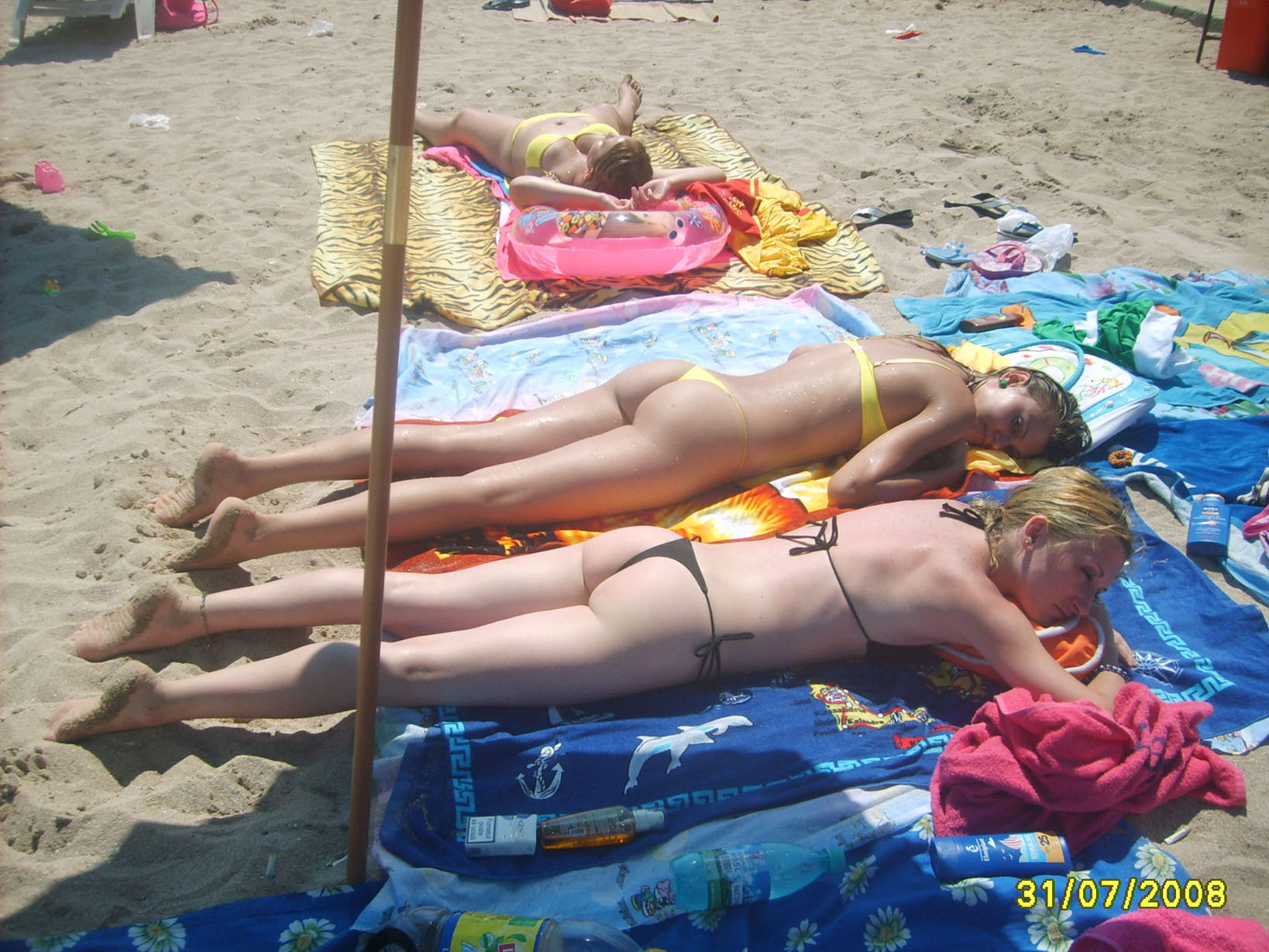 A pair of nudist teen friends steam up the beach #72250021