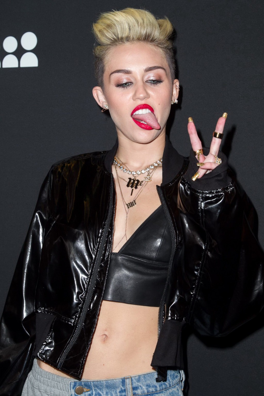 Miley Cyrus wearing a leather crop top at the Myspace launch event #75228697