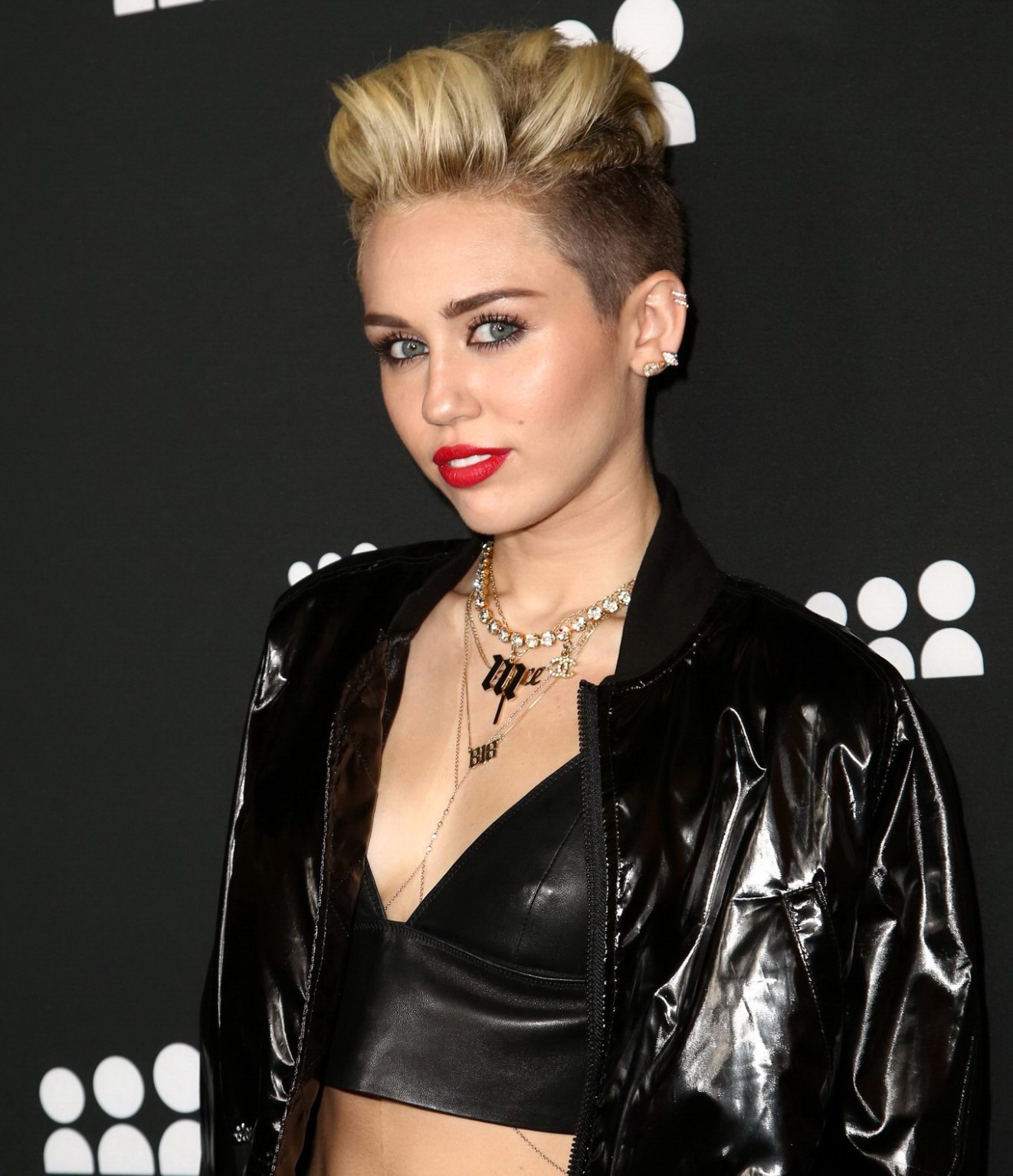 Miley Cyrus wearing a leather crop top at the Myspace launch event #75228726