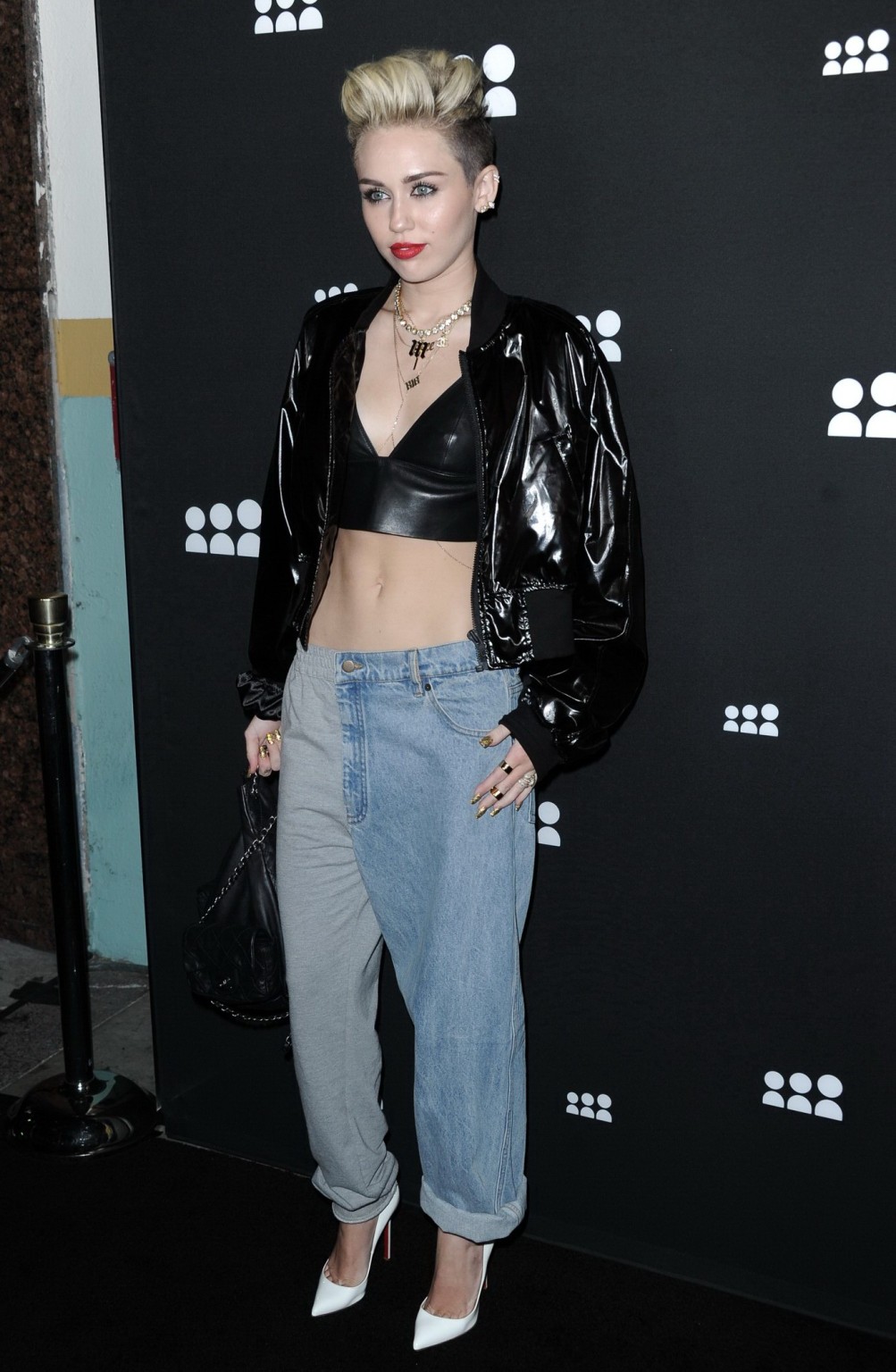 Miley Cyrus wearing a leather crop top at the Myspace launch event #75228755