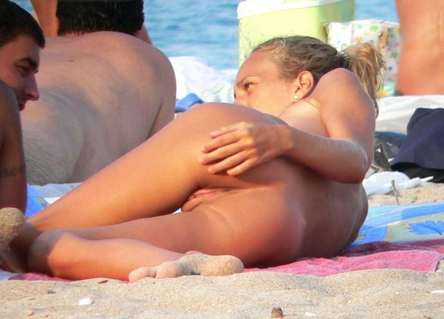 Big breasted blonde has some fun becoming nude on a public beach front #72245238
