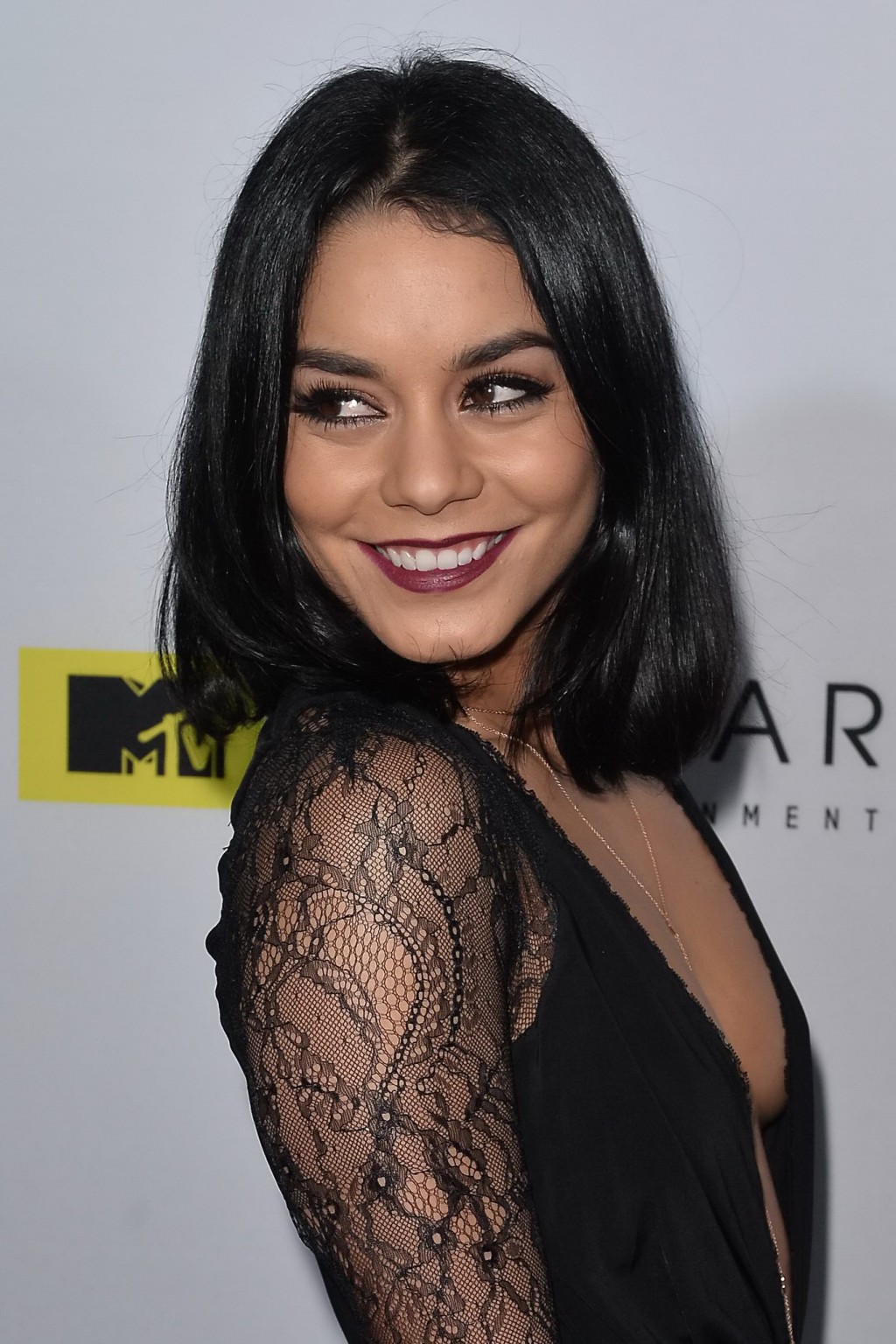 Vanessa Hudgens braless showing deep neckline and legs #75149130