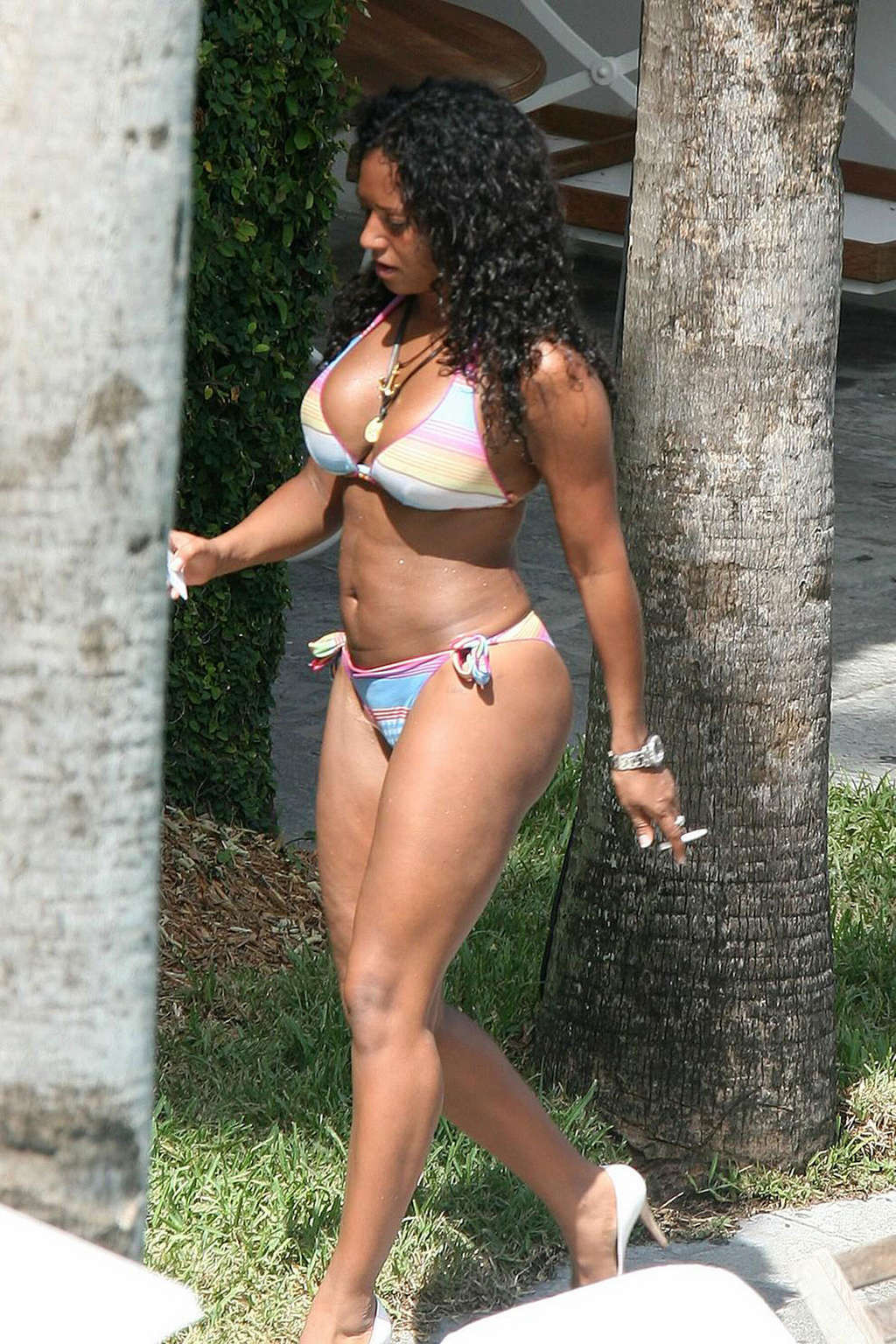 Melanie Brown exposing sexy body and huge boobs in bikini on pool #75325880