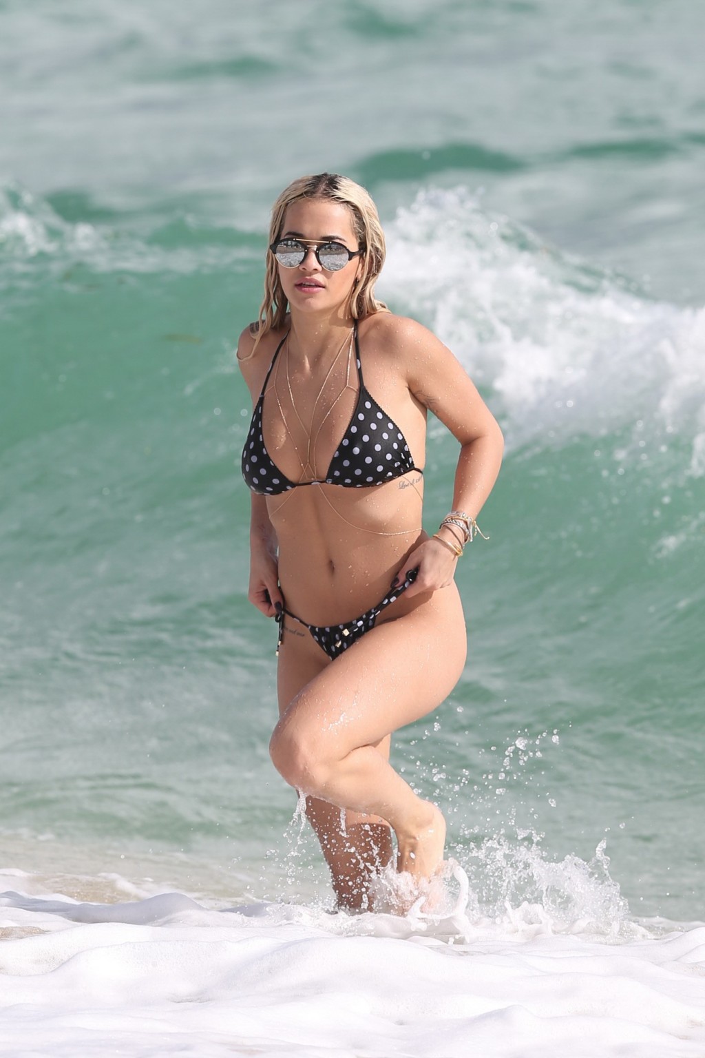 Rita Ora showing pokies and shaven crotch in tiny bikini #75148033