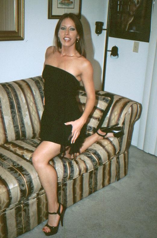 Hot brunette mature mom posing on a couch image