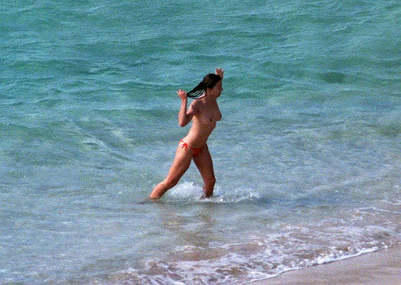 Elizabeth Hurley exposing her sexy nude boobs and hot ass on beach #75316915