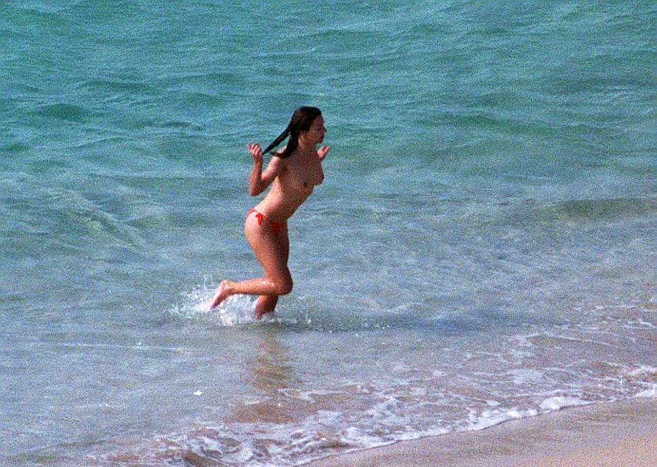 Elizabeth Hurley exposing her sexy nude boobs and hot ass on beach #75316920
