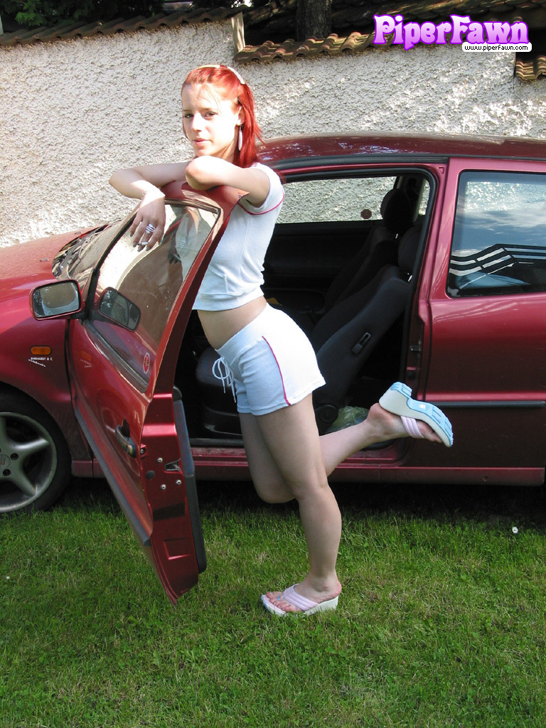Busty redhead teen outside showing her car #78590695
