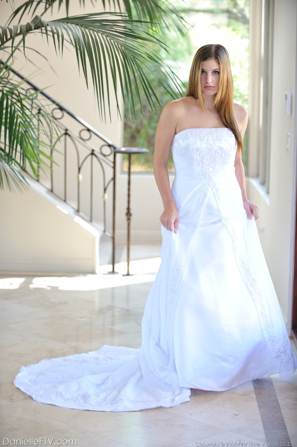 Danielle poses in a long white gown #68501363