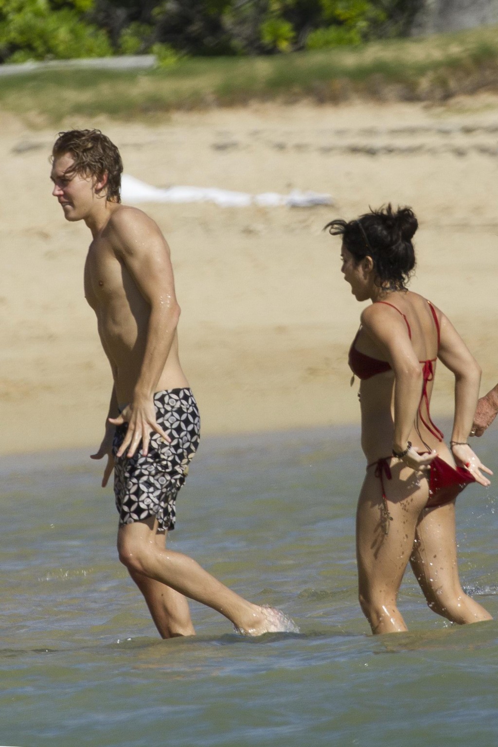 Vanessa Hudgens in sexy red bikini making out with her boyfriend on a Hawaiian b #75275736