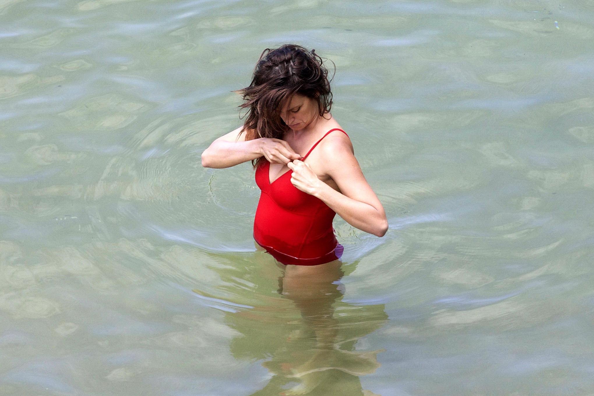 Penelope Cruz showing pokies on a beach wearing a sexy red swimsuit #75192199