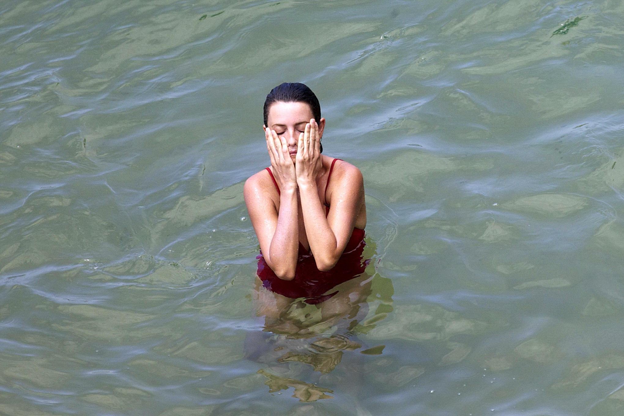 Penelope Cruz showing pokies on a beach wearing a sexy red swimsuit #75192243