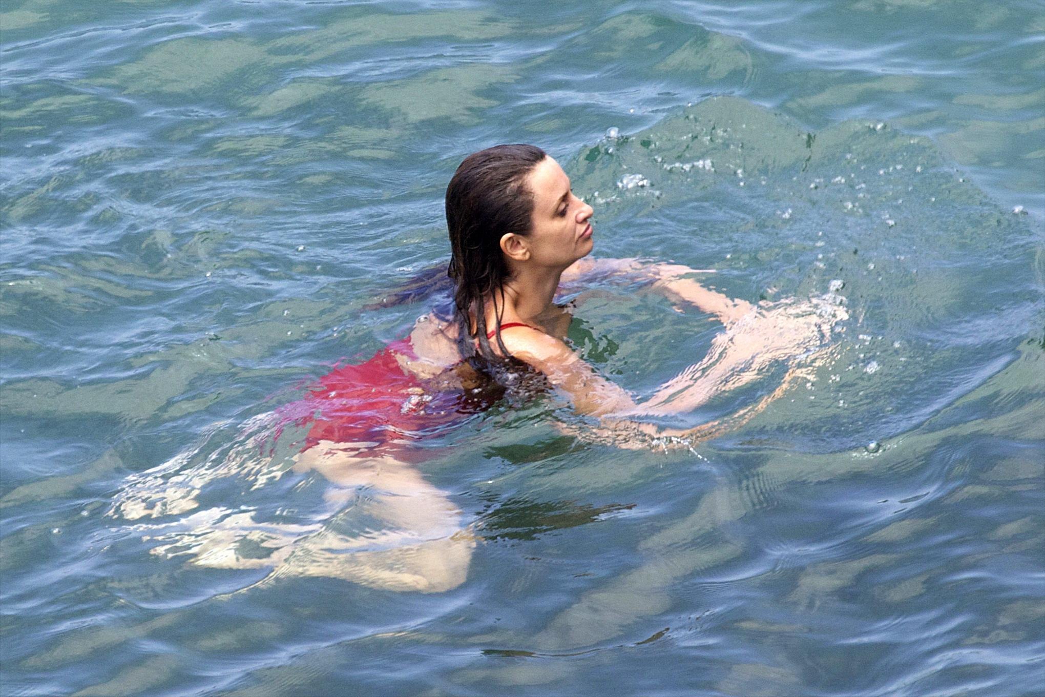 Penelope Cruz showing pokies on a beach wearing a sexy red swimsuit #75192262