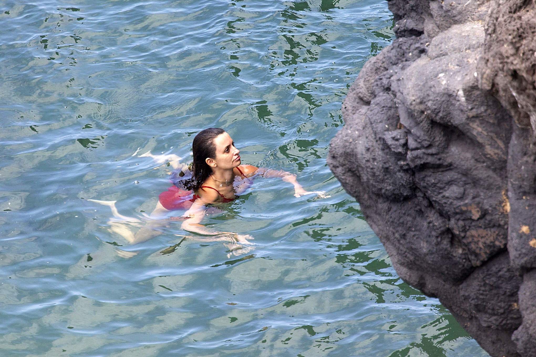 Penelope Cruz showing pokies on a beach wearing a sexy red swimsuit #75192272