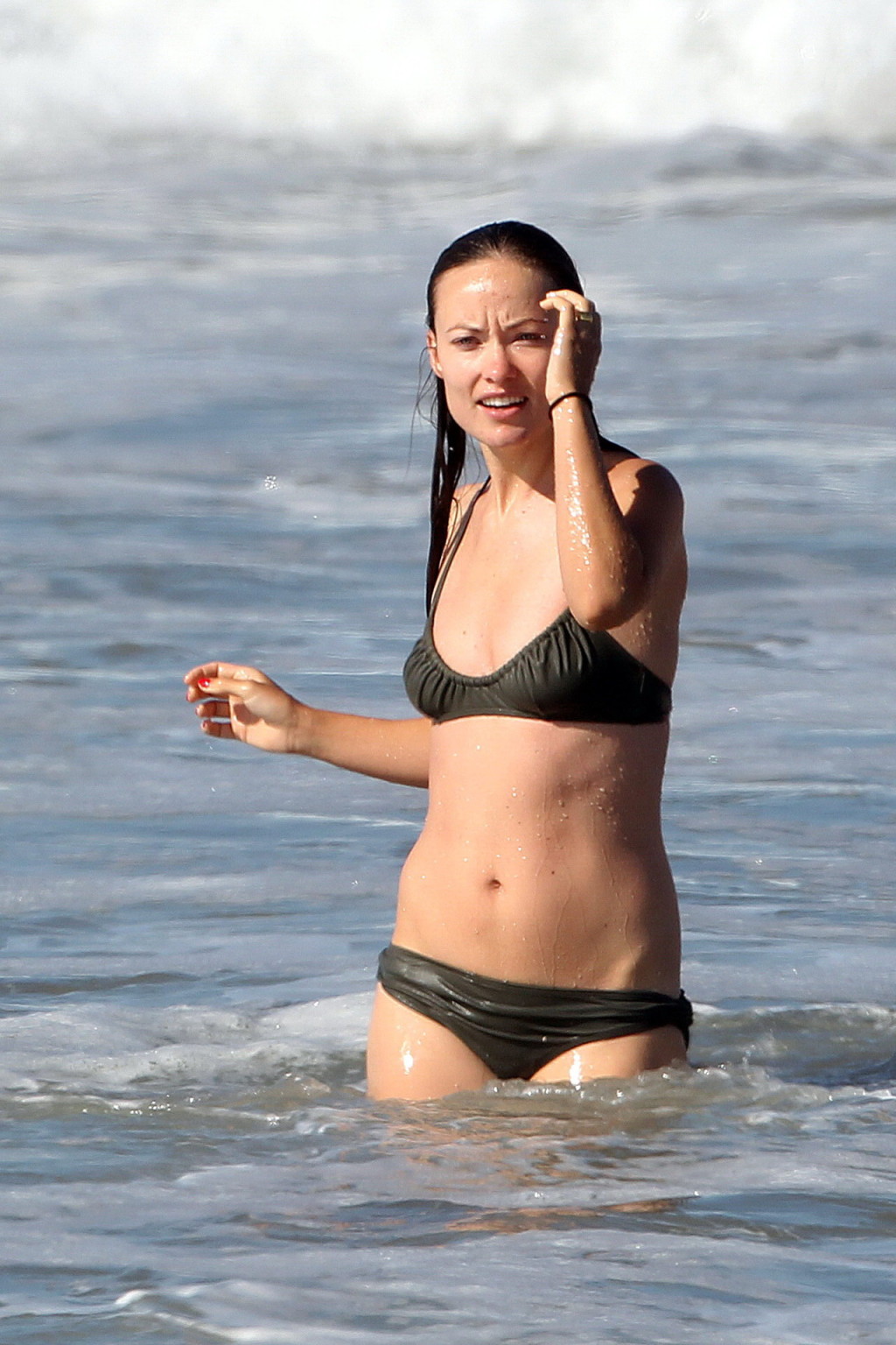 Olivia Wilde looking very sexy in wet bikini on the beach #75335328