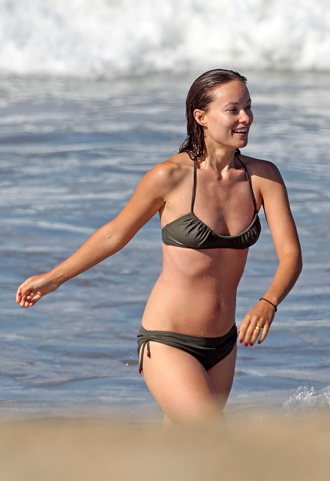 Olivia Wilde looking very sexy in wet bikini on the beach #75335397