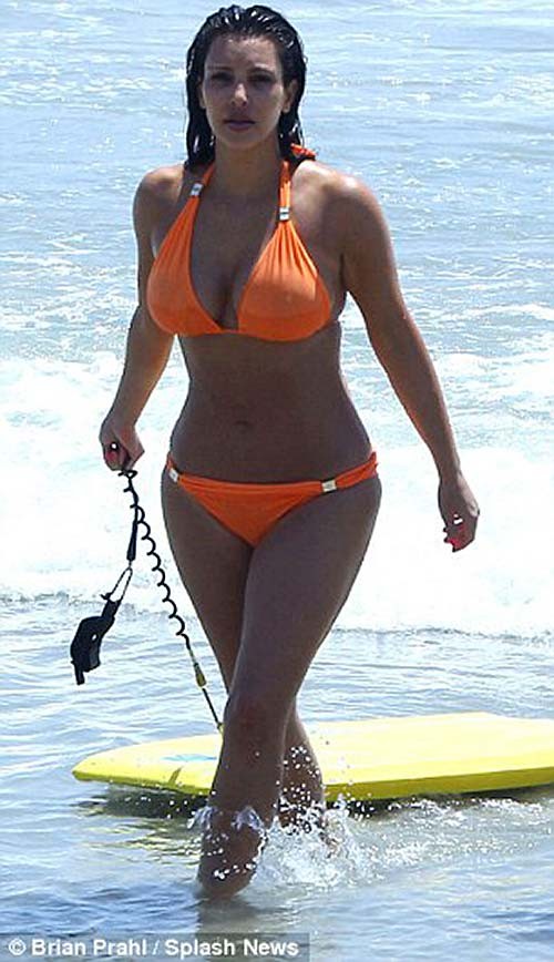 Kim Kardashian exposing sexy body and huge boobs in orange bikini #75263946