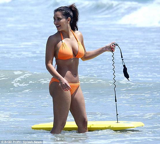 Kim Kardashian exposing sexy body and huge boobs in orange bikini #75263953