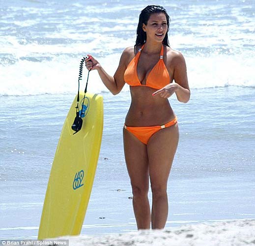 Kim Kardashian exposing sexy body and huge boobs in orange bikini #75263960