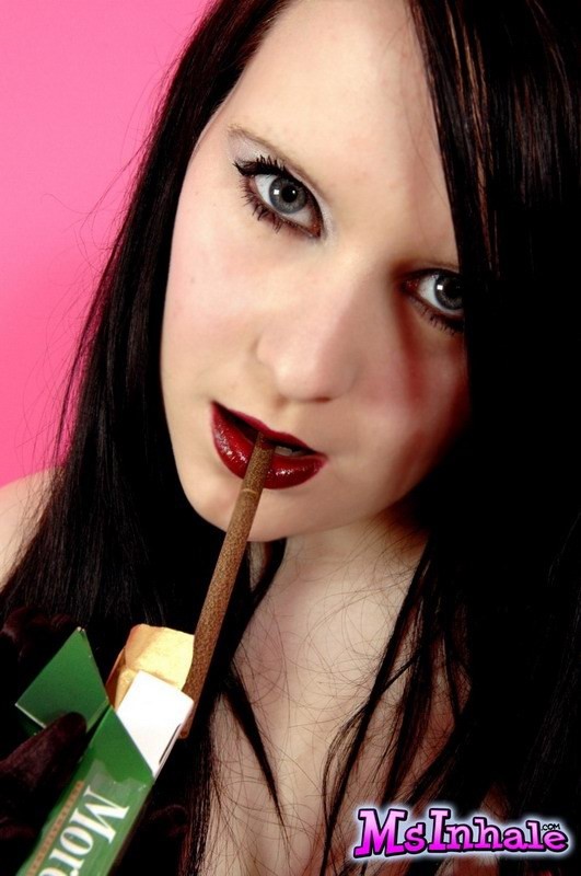 goth teen smoking a cigarette #74983113