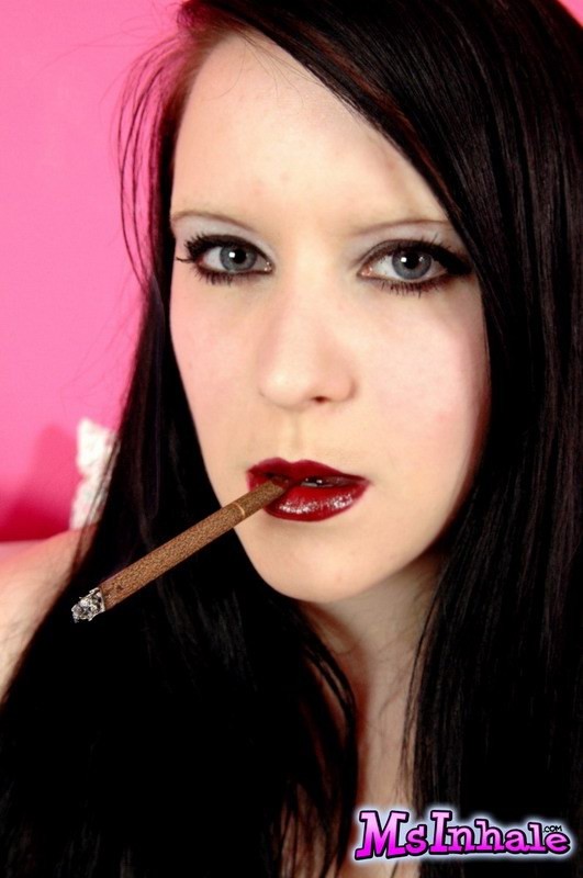 goth teen smoking a cigarette #74983150