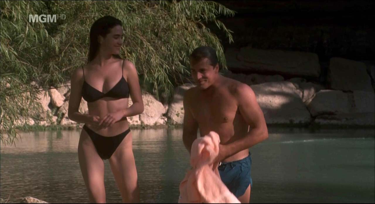 Jennifer Connelly showing her nice boobs and pussy from behind on beach in movie #75309160