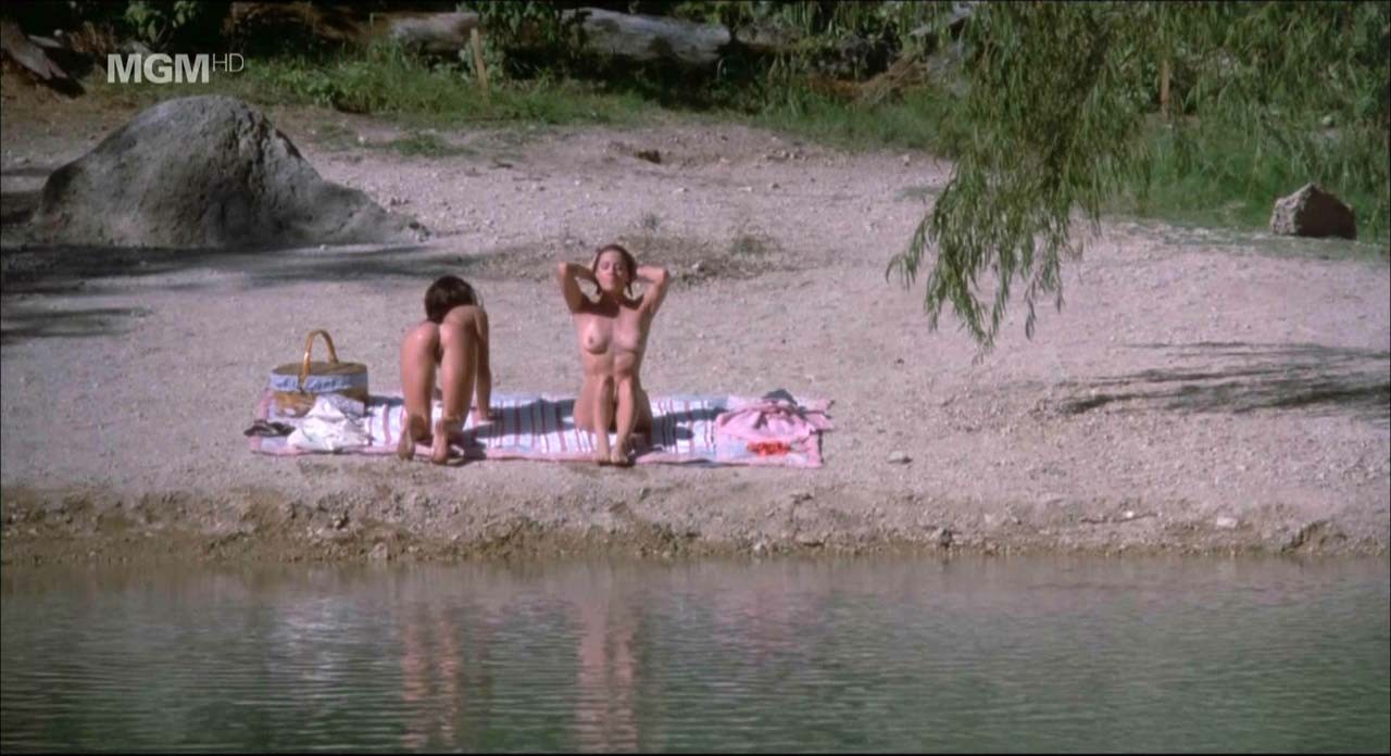 Jennifer Connelly showing her nice boobs and pussy from behind on beach in movie #75309228
