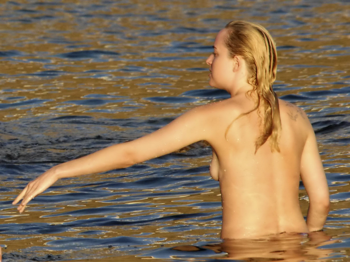Dakota Johnson caught topless at the beach during a vacation in Italy #75180823
