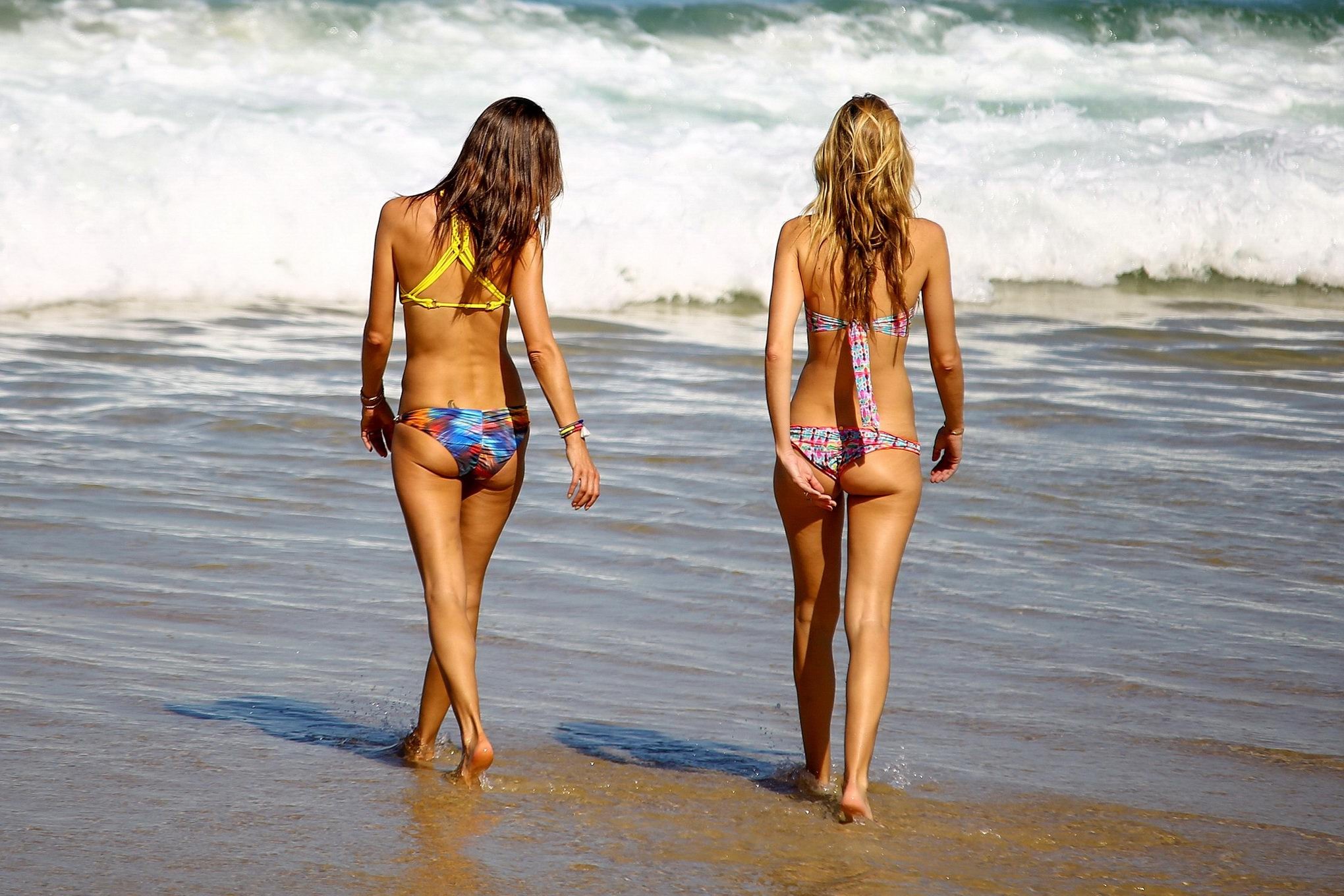 Alessandra Ambrosio showing off her bikini body on a beach