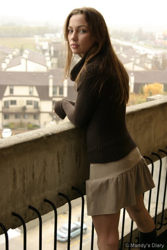 Innocent Mandy posing on the balcony #75098415
