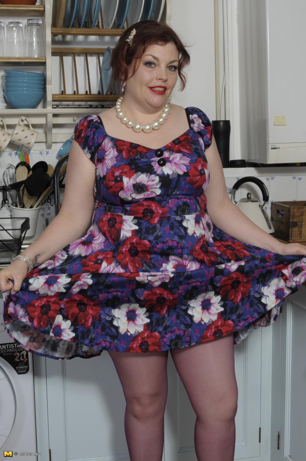 Chubby British housewife playing in her kitchen #67119126