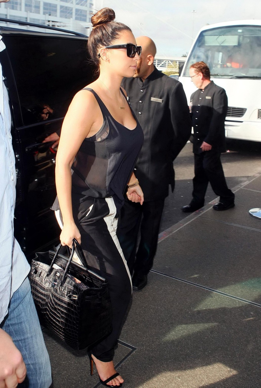 Kim Kardashian bra peak  showing huge cleavage at Sydney Airport #75251671