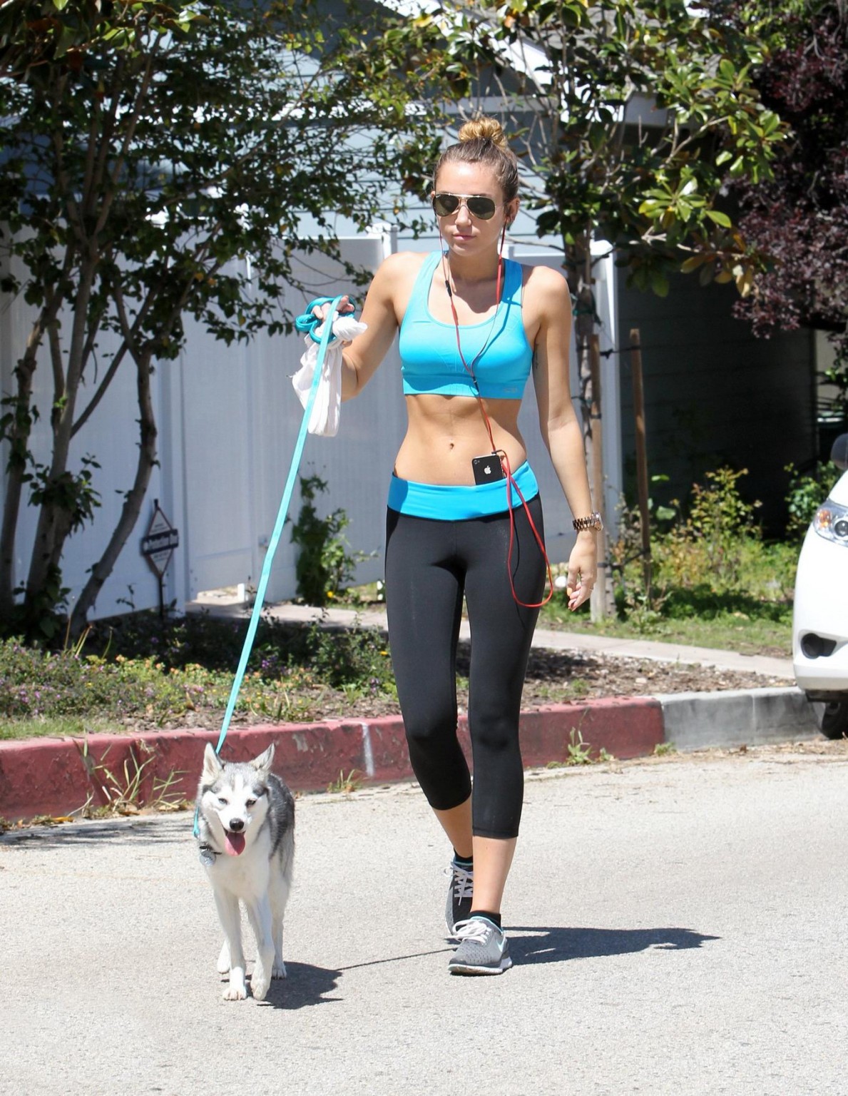 Miley Cyrus shows off her ass wearing sports bra  tights for a jog in LA