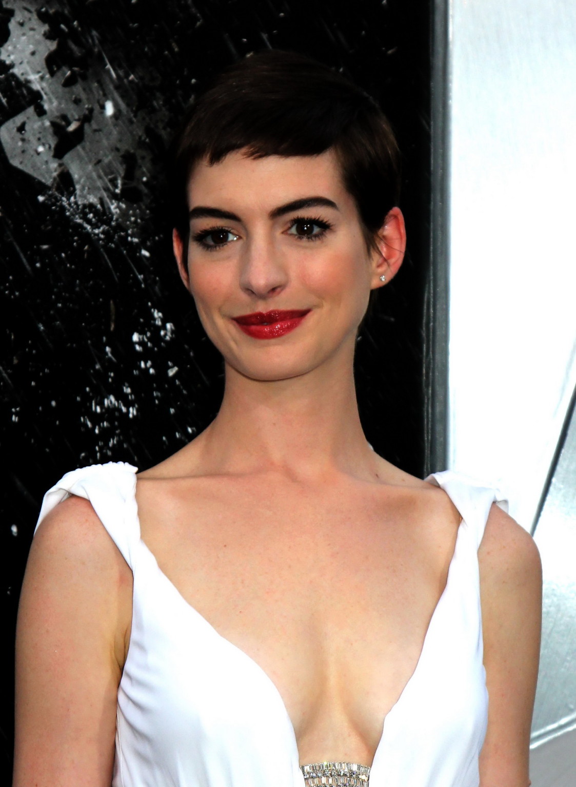 Anne Hathaway showing cleavage in white dress at 'Dark Knight Rises' premiere in #75257406