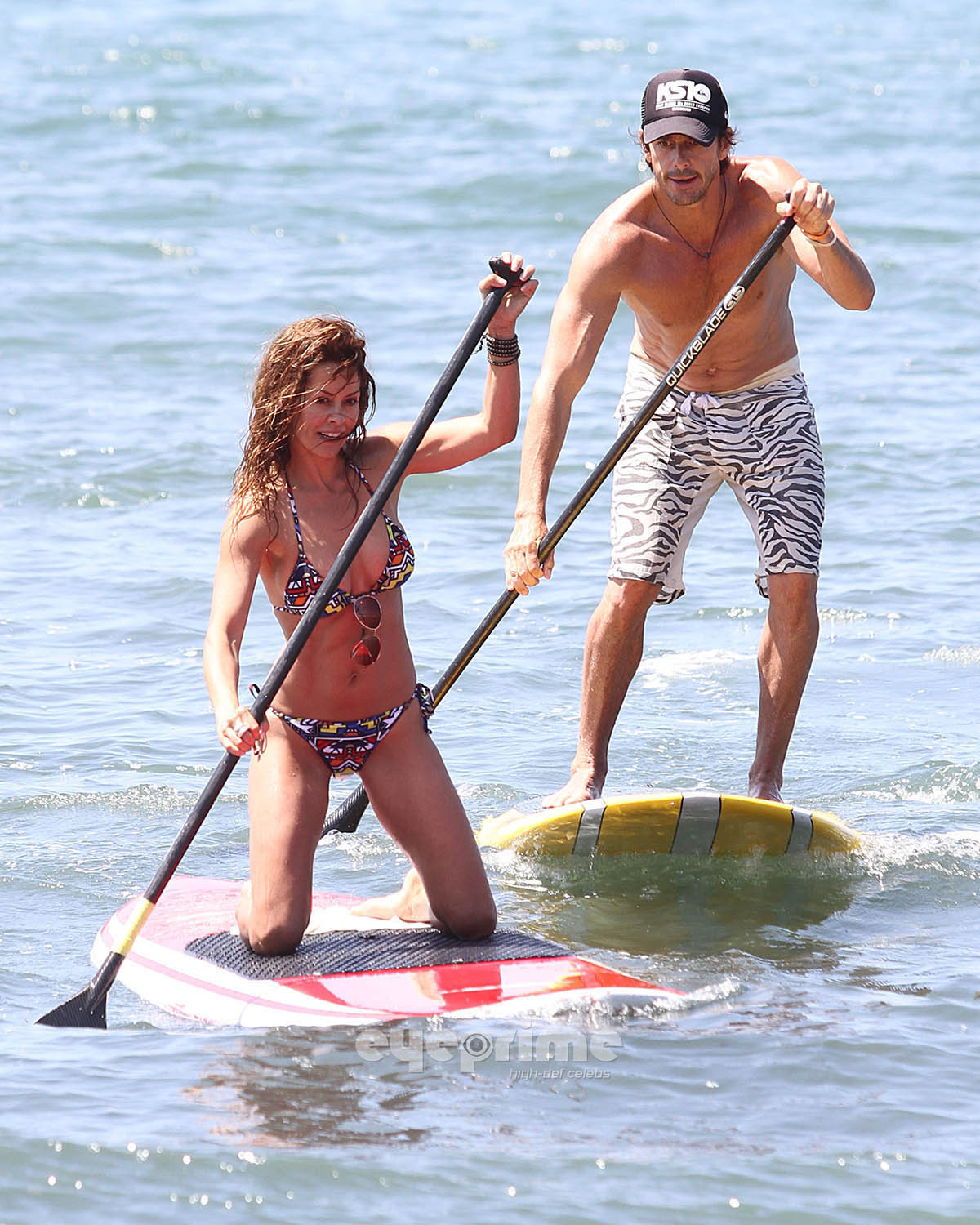 Brooke Burke paddle surfing in bikini on the Malibu Beach #75293464