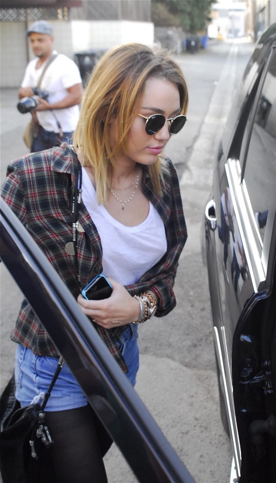 Miley Cyrus braless showing pokies outside Wokcano Restaurant in LA #75275529