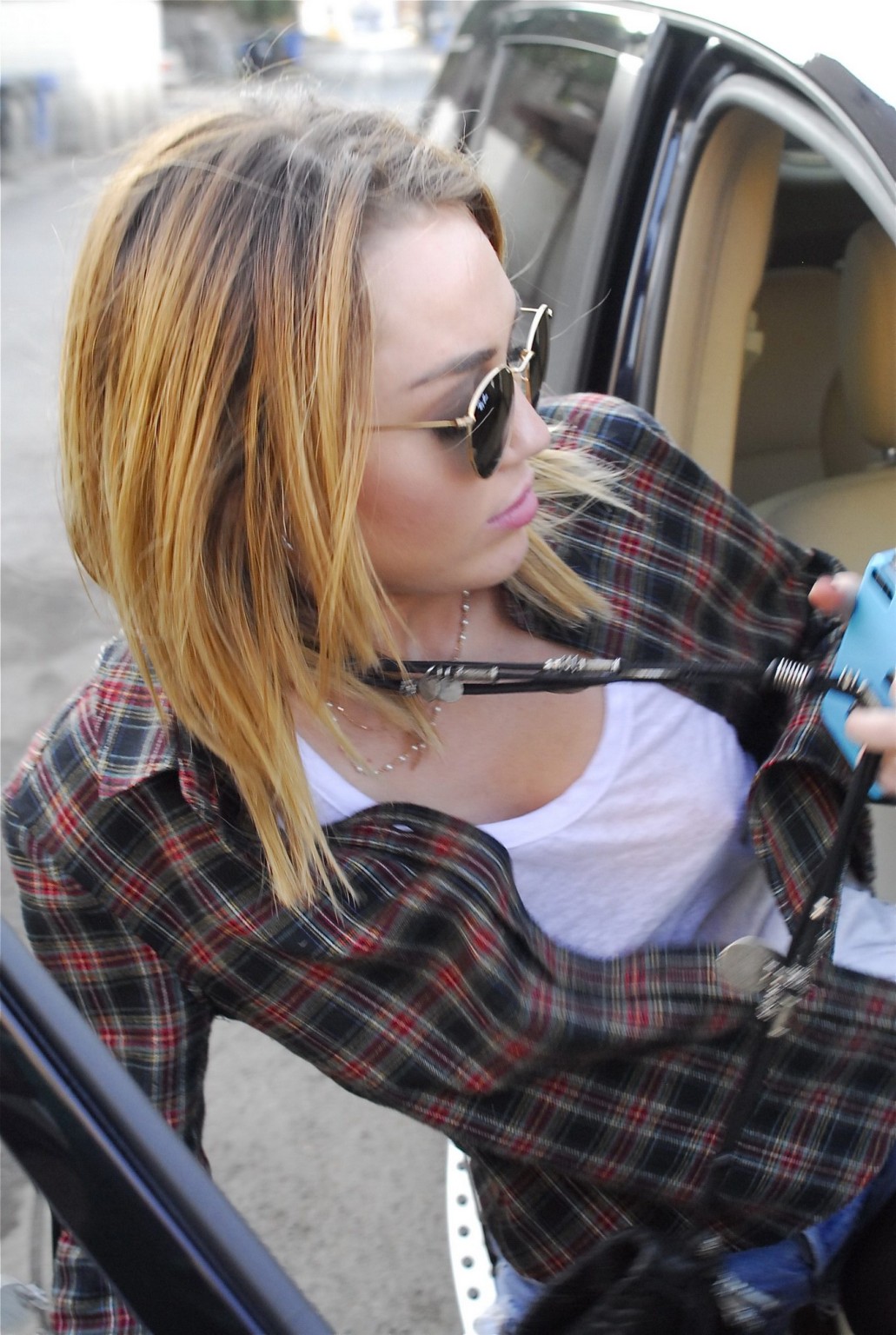 Miley Cyrus braless showing pokies outside Wokcano Restaurant in LA #75275538