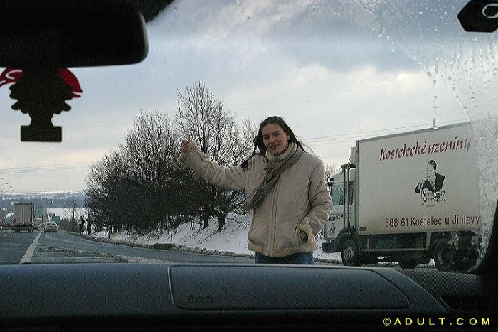 teen hitchhiker flashes her perfect smile #74994413