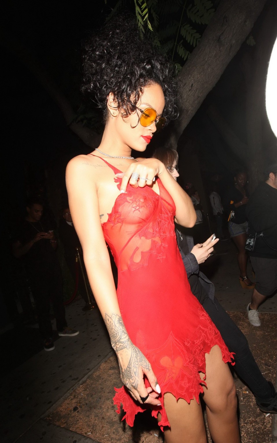 Rihanna shows off her boobs wearing a red see through dress at Hooray Henrys in  #75191832