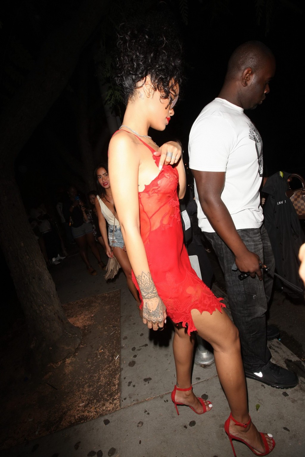 Rihanna shows off her boobs wearing a red see through dress at Hooray Henrys in  #75191931