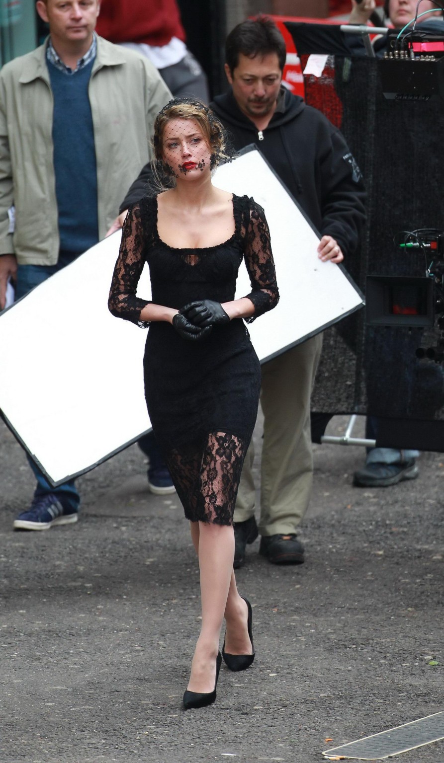 Amber Heard busty wearing a black lace dress on the set of 'London Fields' in Lo #75218378