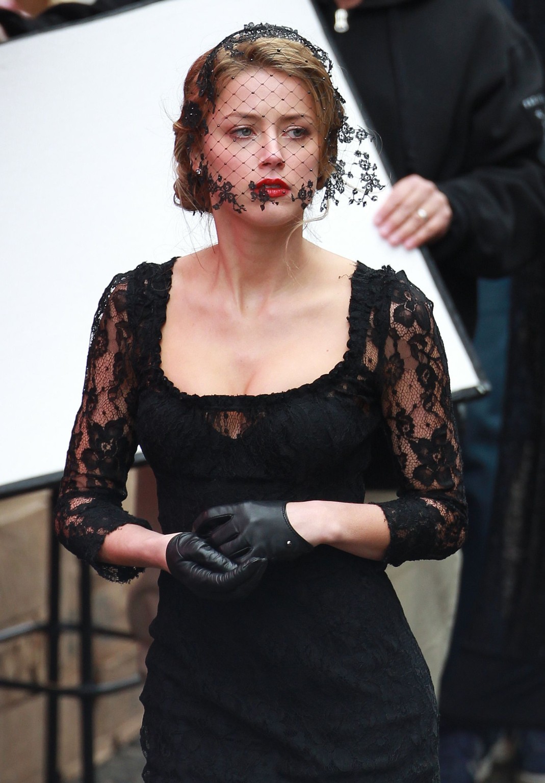 Amber Heard busty wearing a black lace dress on the set of 'London Fields' in Lo #75218428