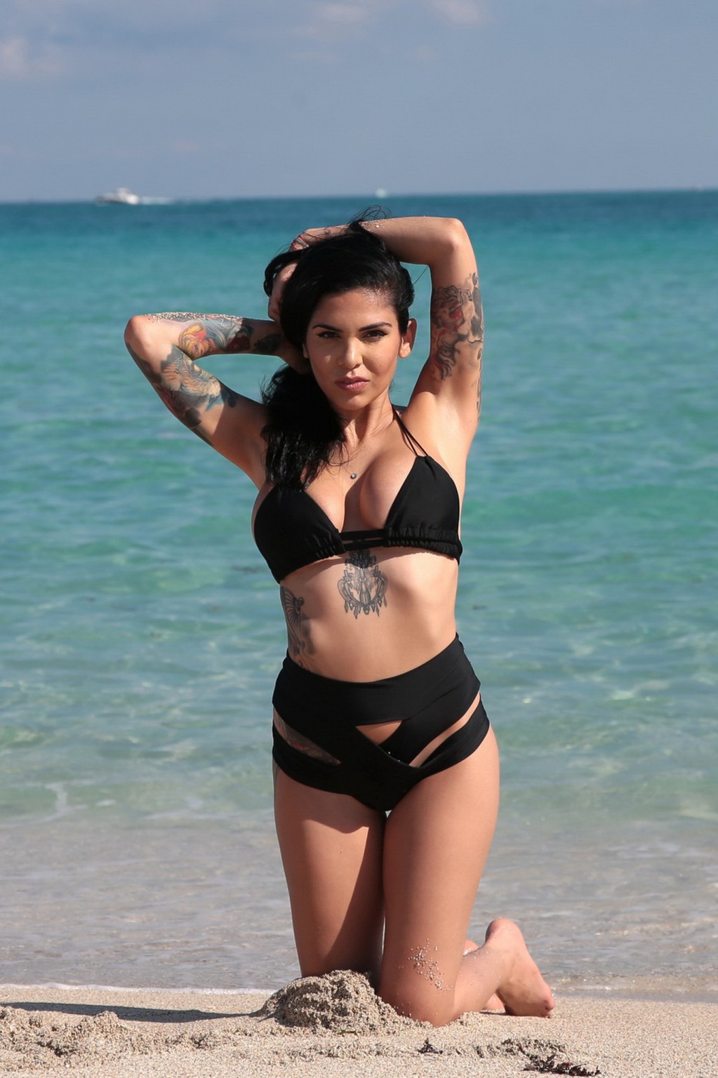 Cami Li showing sideboob and ass in black bikini at the beach in Miami #75175403