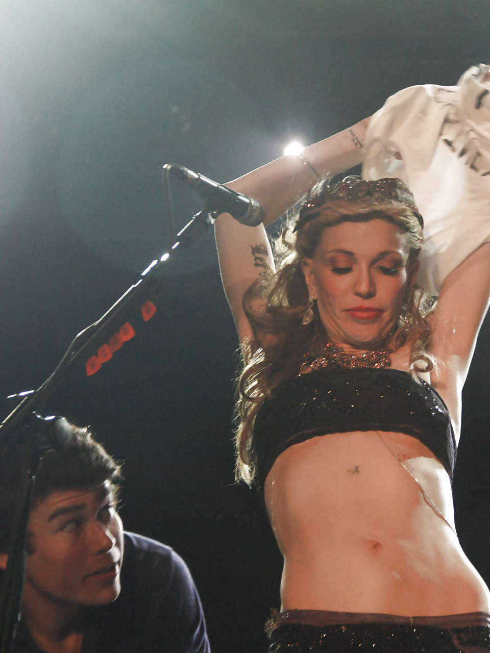 Courtney Love stripping down to topless and show tits on stage #75279467