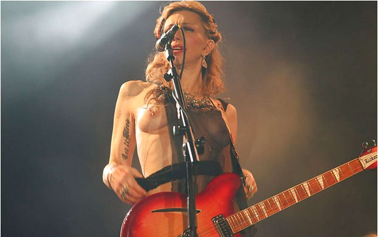 Courtney Love stripping down to topless and show tits on stage #75279512