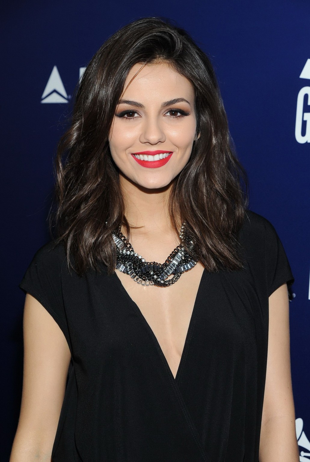 Victoria Justice showing big cleavage in black mini dress at Delta Air Lines GRA #75173556