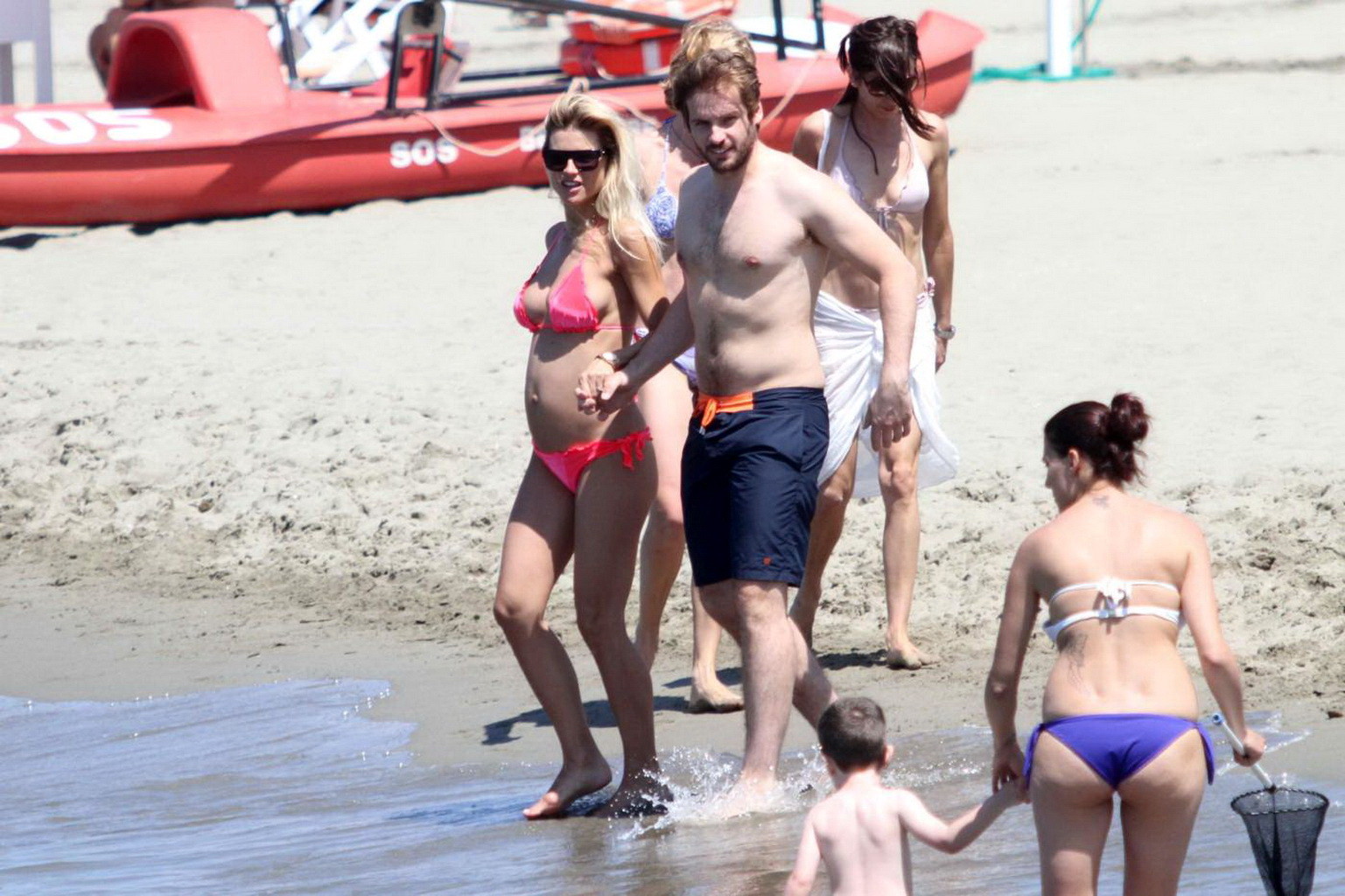 Michelle Hunziker pregnant wearing a bikini on the beach in Forte dei Marmi, Ita