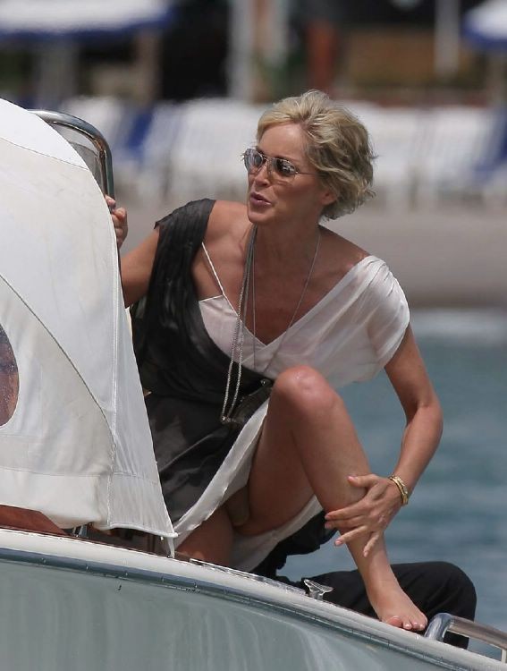 Sharon Stone topless in a bikini at the beach in these pics #75380739