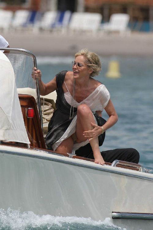 Sharon Stone topless in a bikini at the beach in these pics #75380742