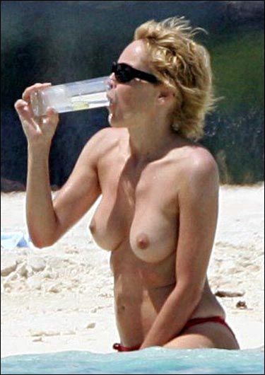 Sharon Stone topless in a bikini at the beach in these pics #75380747